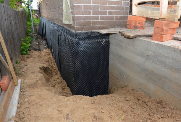 Happy homeowners after waterproofing job in Wild Rose